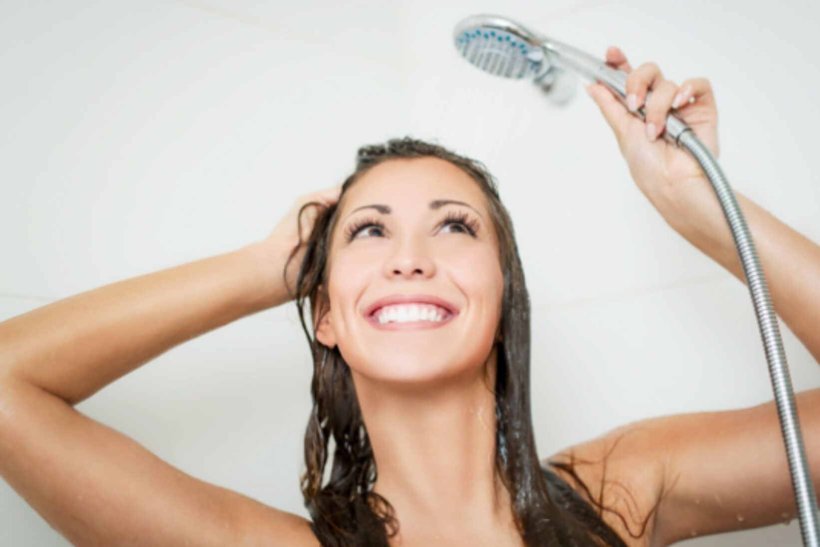 woman smiling and showering germs